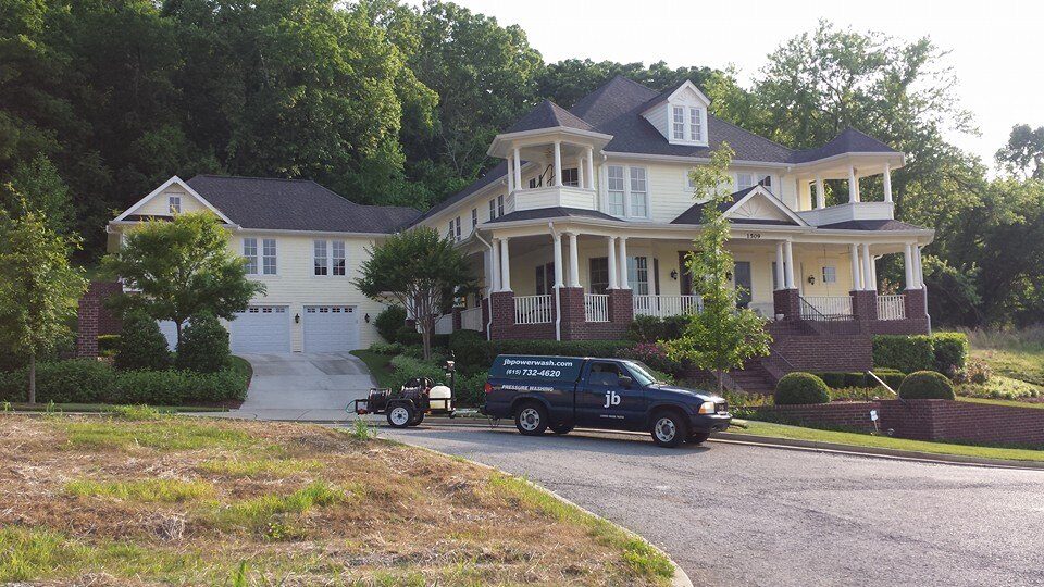 Pressure washing a residential concrete surface