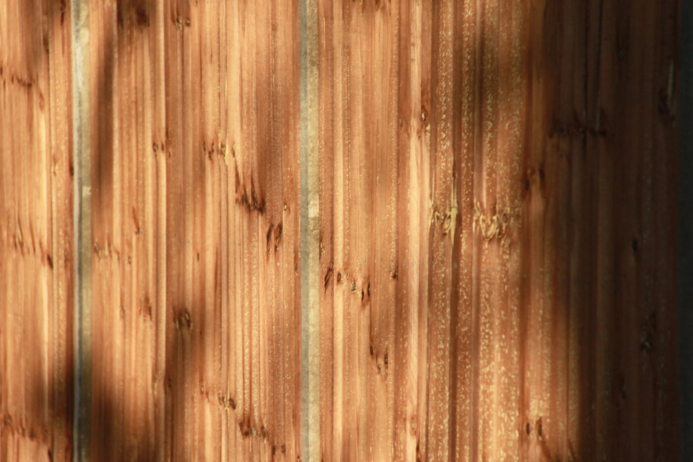 Close-up of restored wooden fence boards
